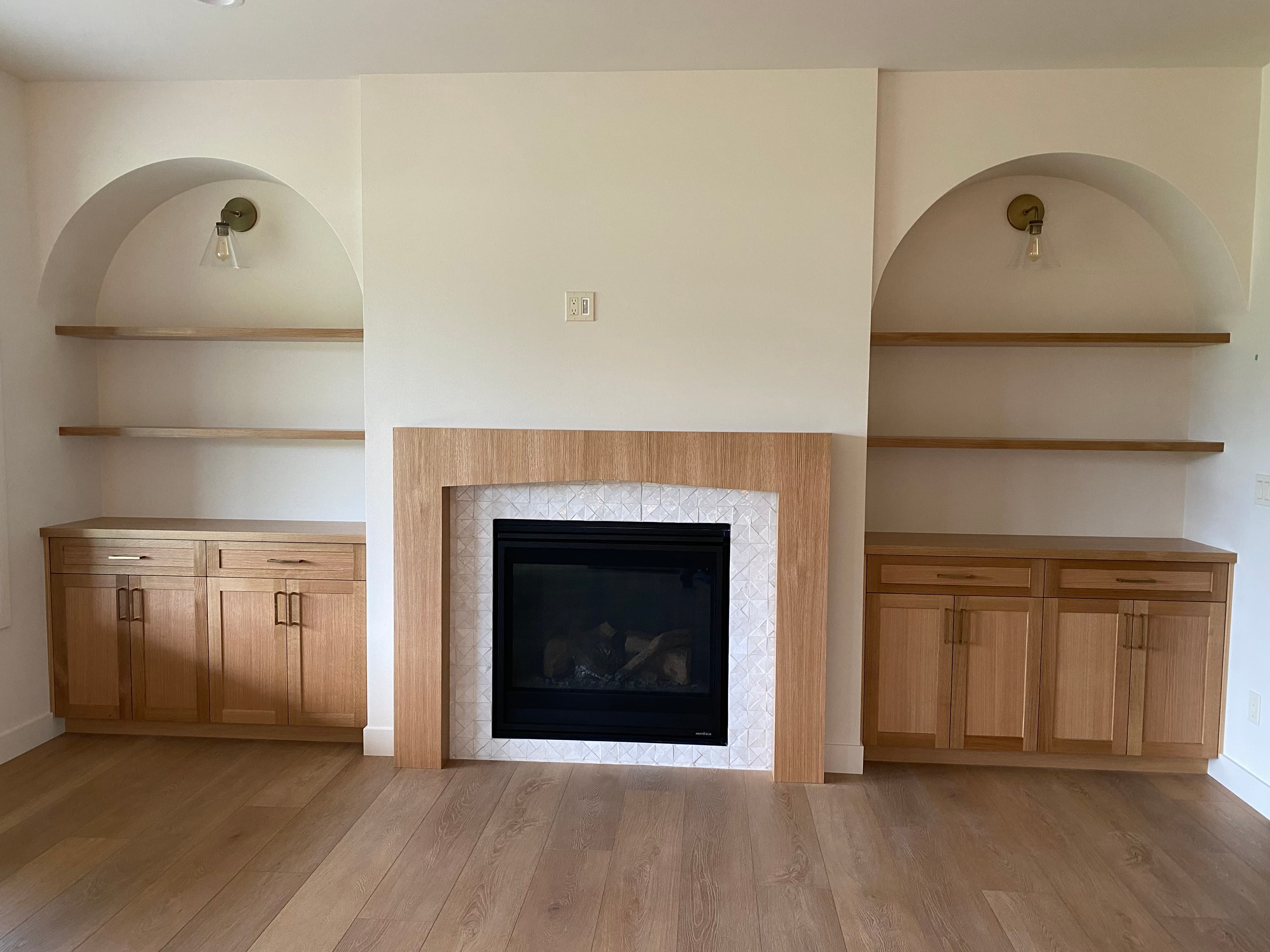 Built in cabinetry and a mantle